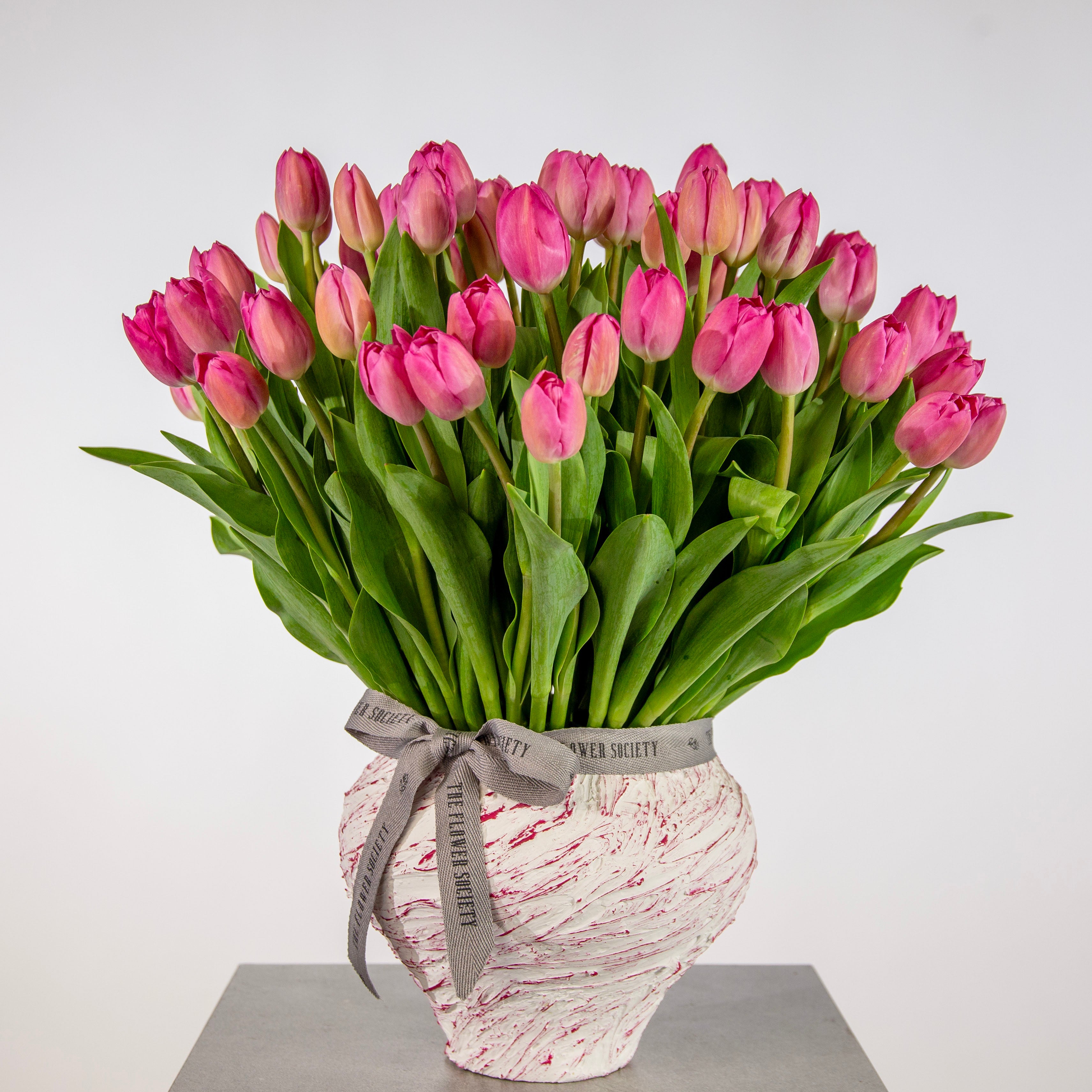 Vibrant pink tulip clay pot bouquet flowers - luxury fuchsia tulip Mother's Day UAE florist